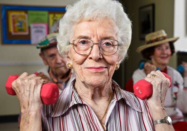 Senior citizen lifting weights